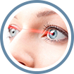 A woman with blue eyes and red eye lashes.